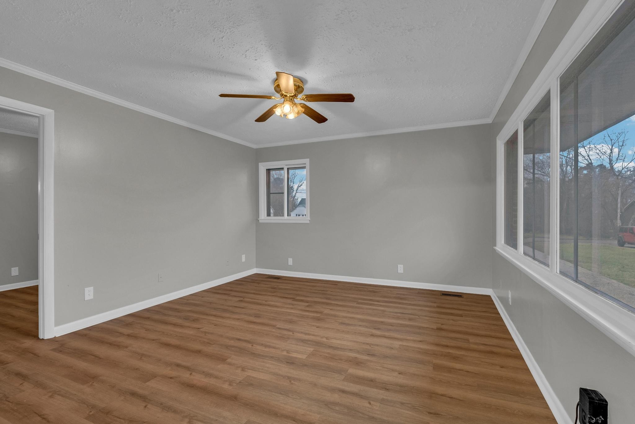 540 4th Avenue South Baxter, TN 38544 - Photo 22 of 26 a view of empty room with wooden floor and fan