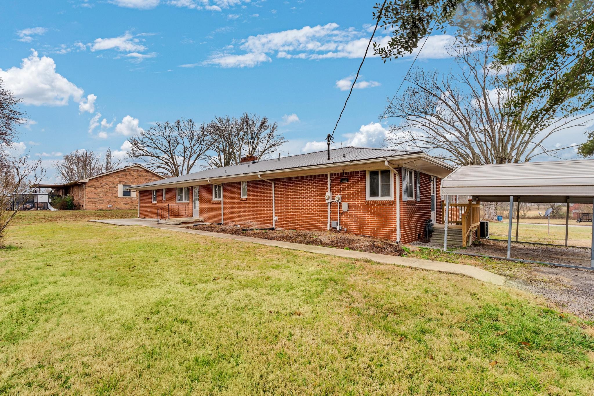 540 4th Avenue South Baxter, TN 38544 - Photo 26 of 26 a front view of a house with a garden
