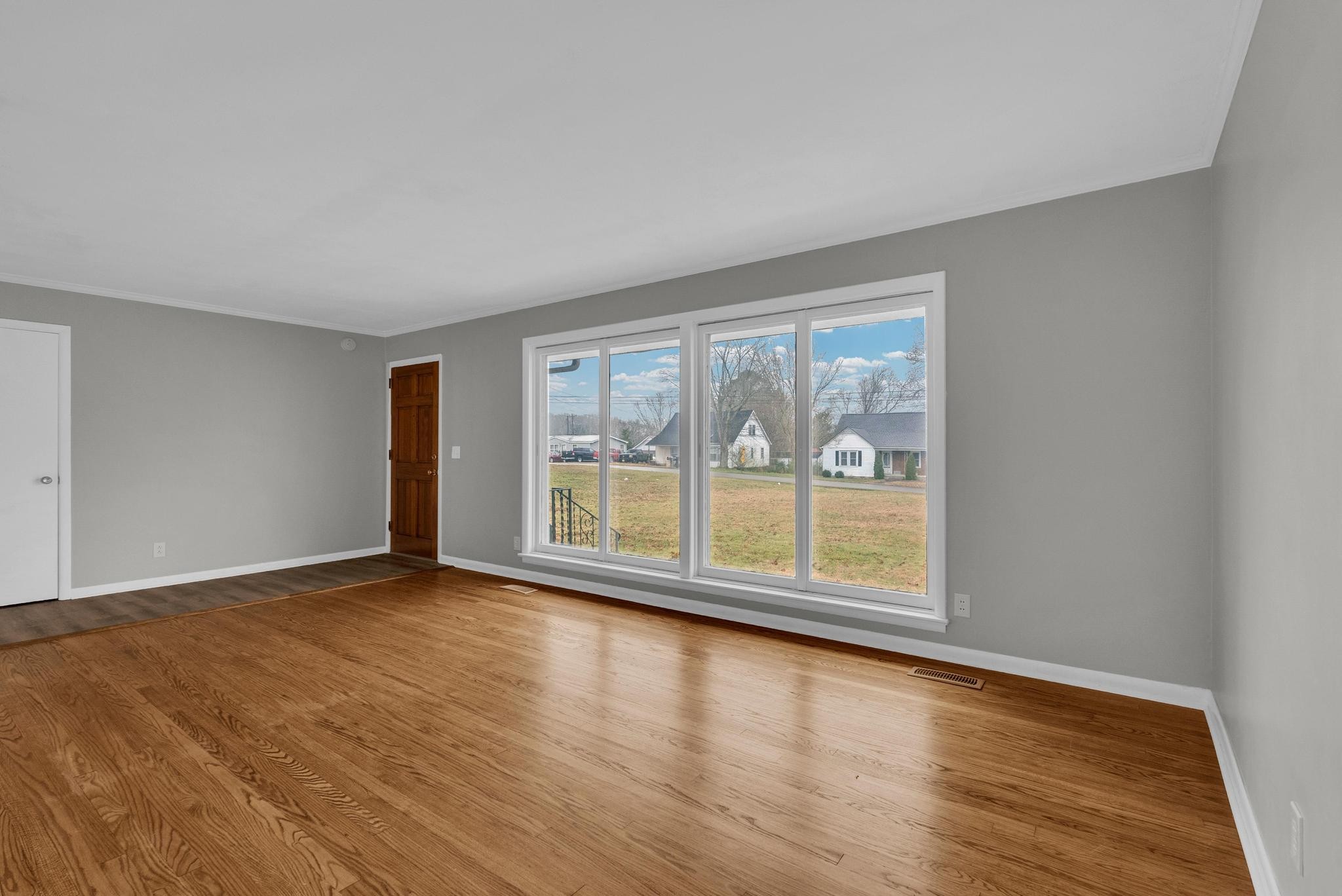 540 4th Avenue South Baxter, TN 38544 - Photo 6 of 26 a view of an empty room with wooden floor and a window