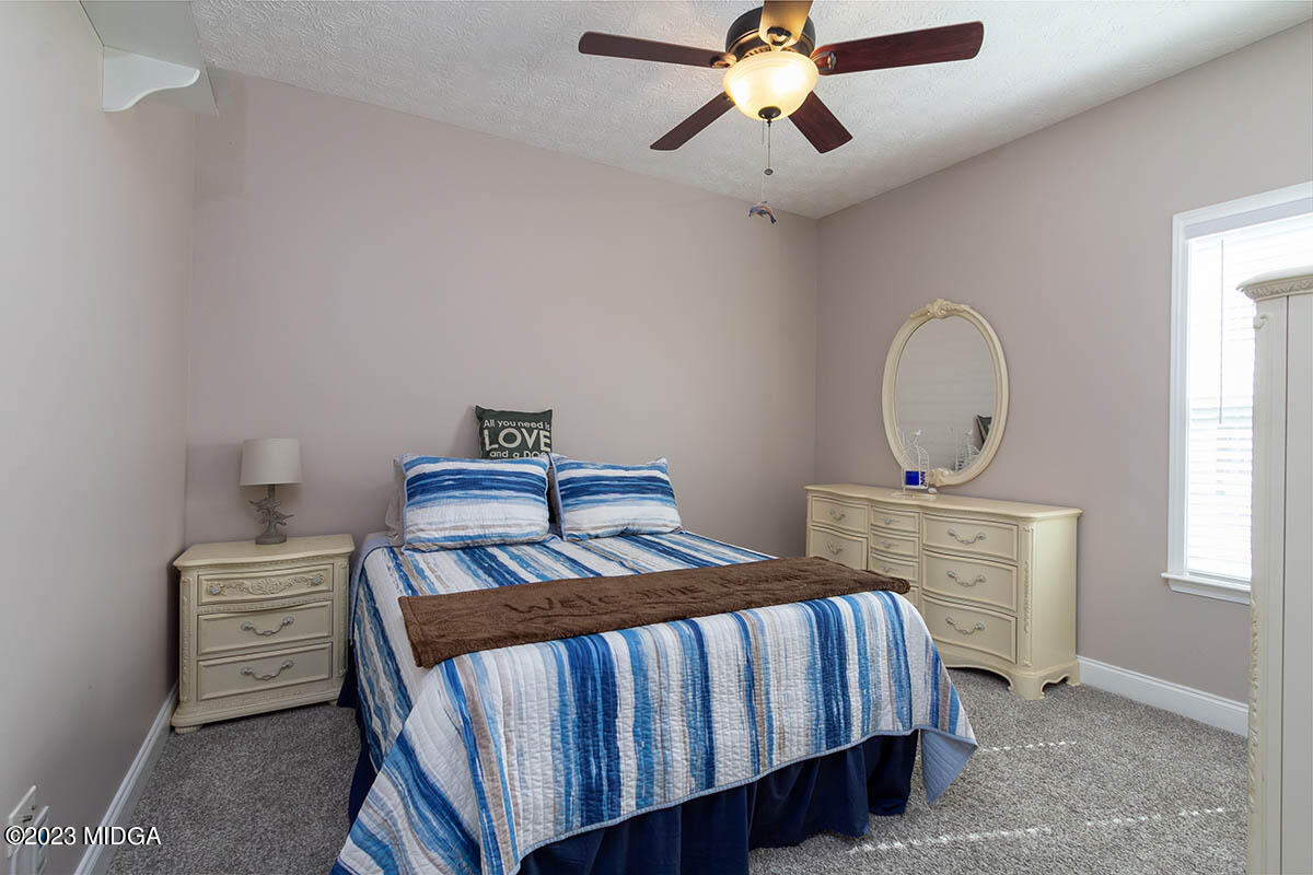 170 Terrell Road Elko, GA 31025 - Photo 17 of 35 a bedroom with a bed dresser and a window