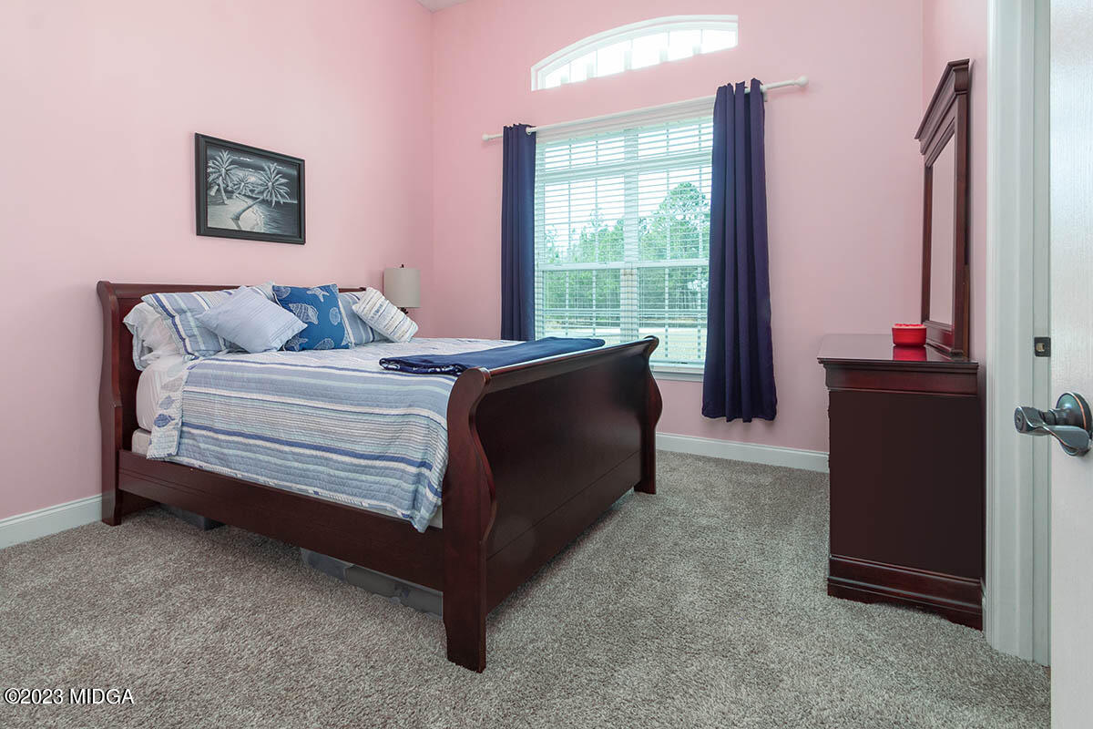 170 Terrell Road Elko, GA 31025 - Photo 20 of 35 a bed room with a bed and a chair