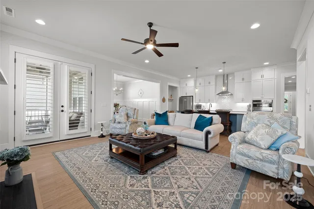 a living room with furniture flat screen tv and a fireplace