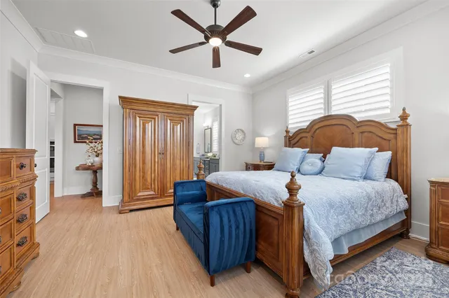 a bathroom with a double vanity sink toilet and shower