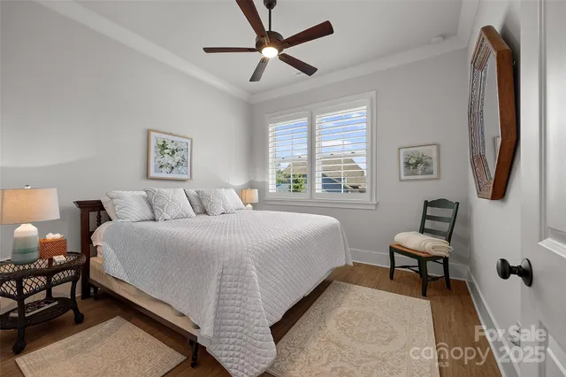 a spacious bedroom with a bed and a walk in closet