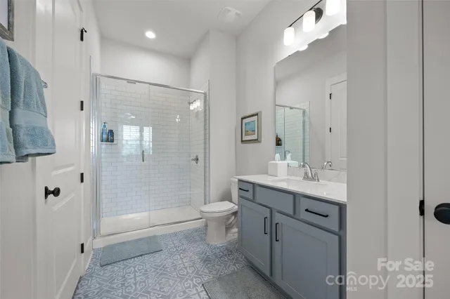 a view of a hallway with wooden floor and stairs