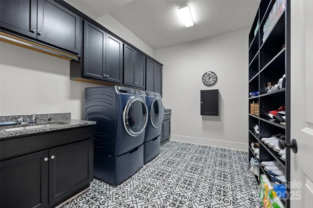 a bathroom with a double vanity sink a toilet and a shower