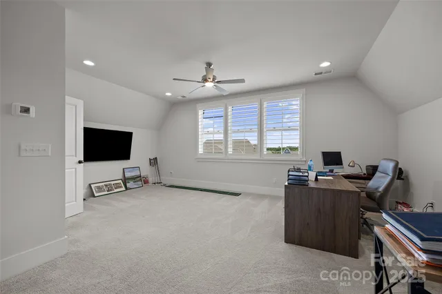 a view of a room with air conditioner duct and materials on floor