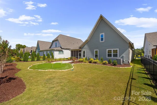 an aerial view of a house with a swimming pool