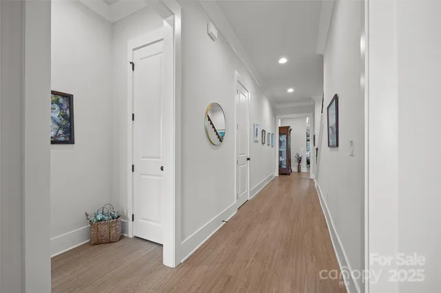 a large kitchen with kitchen island a stove a sink a refrigerator and a fireplace