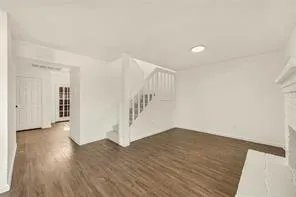 a view of entryway with wooden floor