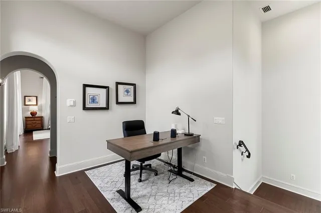 a workspace with furniture and wooden floor