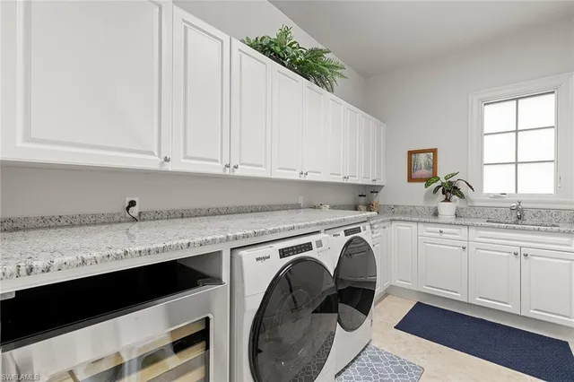 a view of cabinets a sink and dishwasher in a kitchen