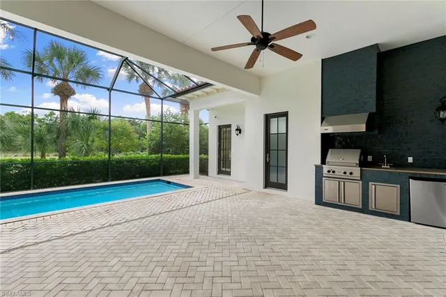 a view of a kitchen with a sink and cabinets