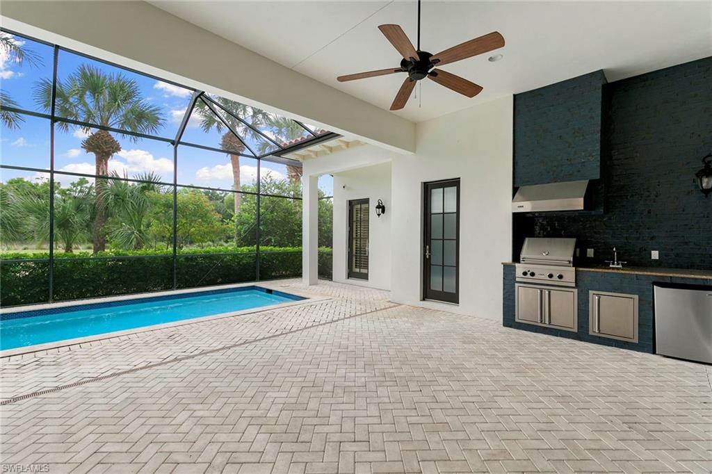 2896 Tiburon Boulevard East Naples, FL 34109 - Photo 34 of 43 a view of a kitchen with a sink and cabinets