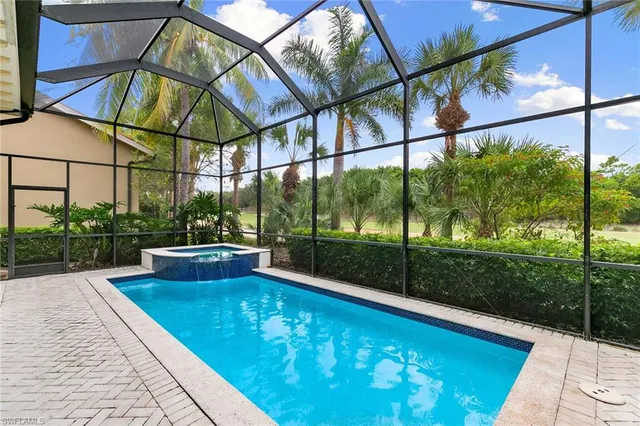 a view of swimming pool with a patio