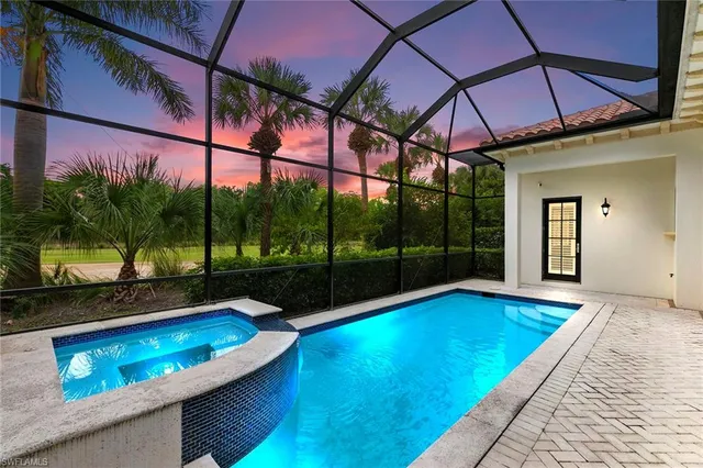 a view of swimming pool with a patio