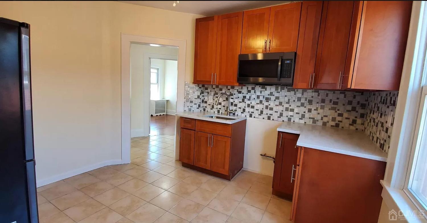 116 Race Street Elizabeth, NJ 07202 - Photo 5 of 7 a bathroom with a sink and a mirror