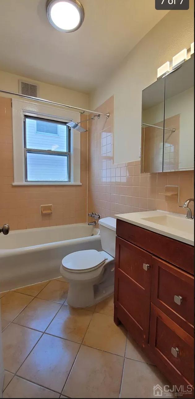 116 Race Street Elizabeth, NJ 07202 - Photo 7 of 7 a bathroom with a sink a toilet and bathtub