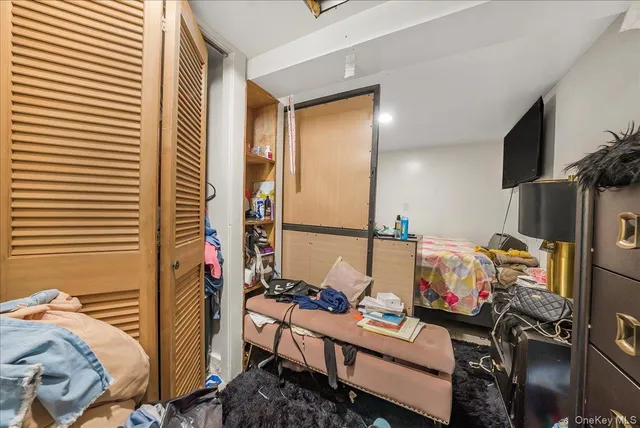 a room with furniture and a flat screen tv