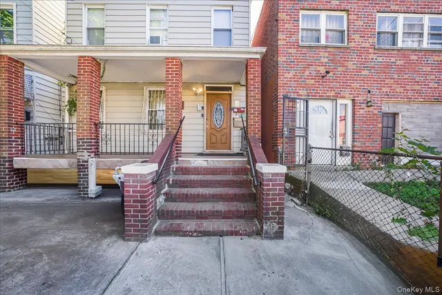 a view of a house with a bench in patio