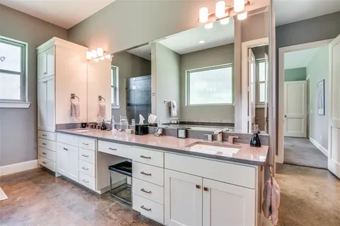 a bathroom with a tub and a window