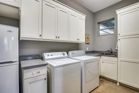 a view of a patio with a table chairs and a backyard