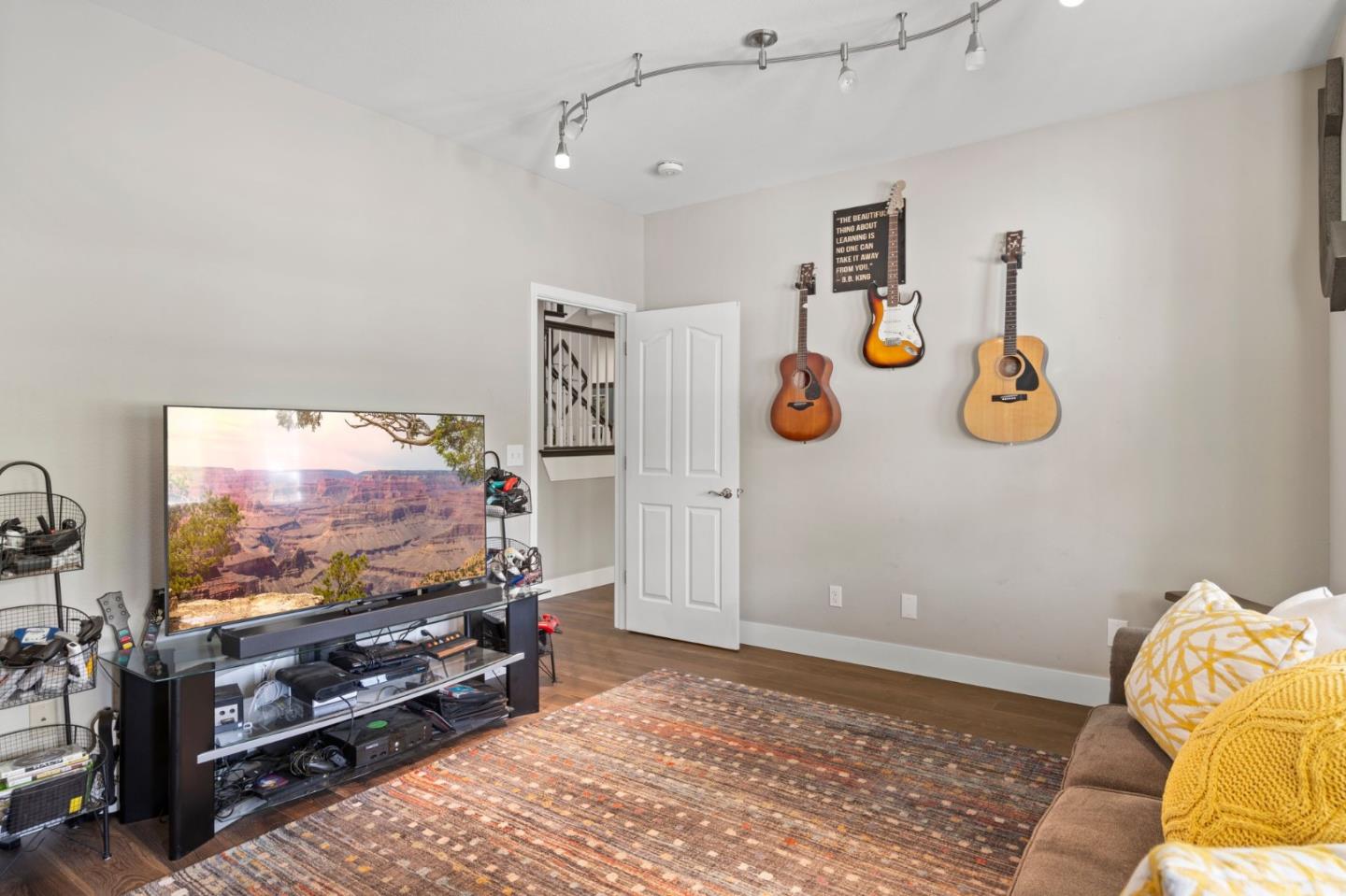 12135 Watsonville Road Gilroy, CA 95020 - Photo 21 of 83 a living room with furniture and a flat screen tv