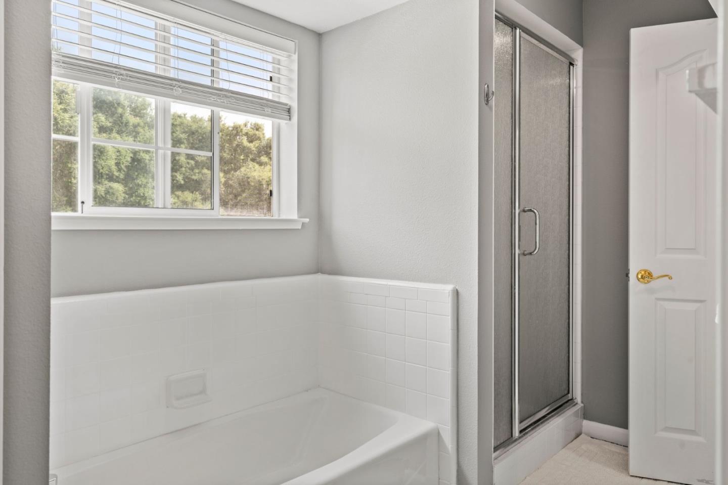 12135 Watsonville Road Gilroy, CA 95020 - Photo 26 of 83 a white bath tub sitting next to a window