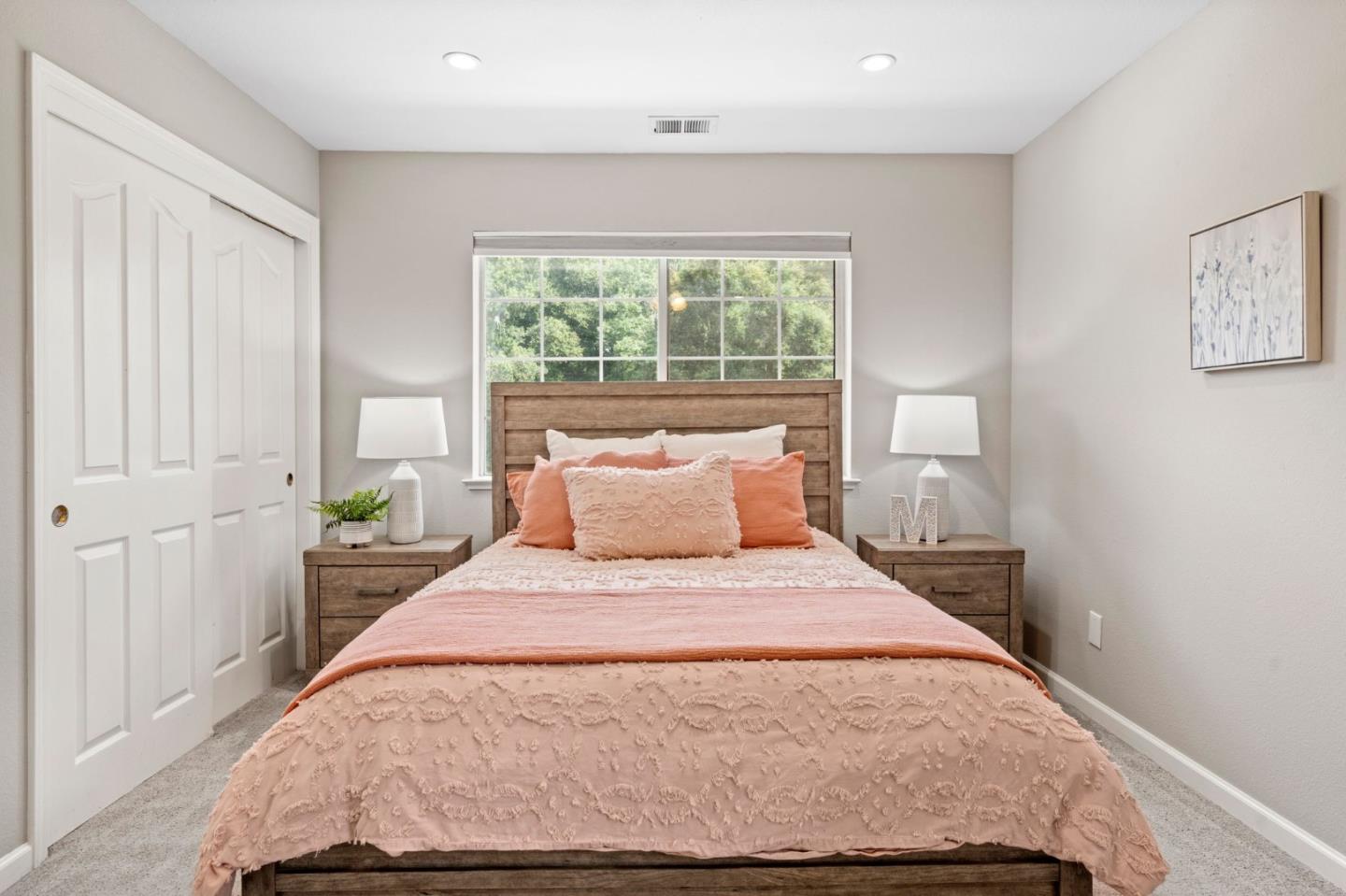 12135 Watsonville Road Gilroy, CA 95020 - Photo 28 of 83 a large bed sitting in a bedroom next to a window