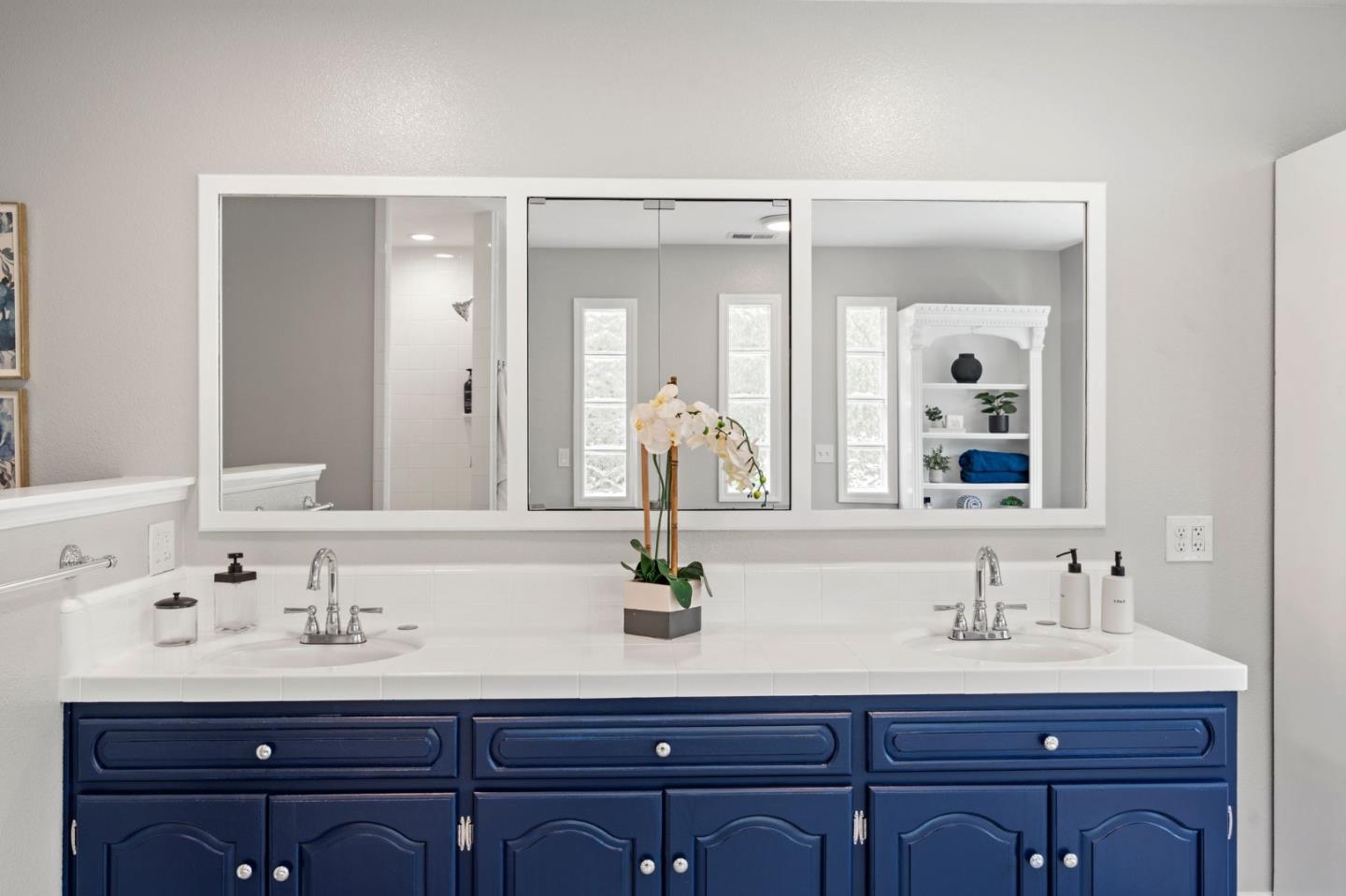 12135 Watsonville Road Gilroy, CA 95020 - Photo 34 of 83 a bathroom with double sink and two mirror
