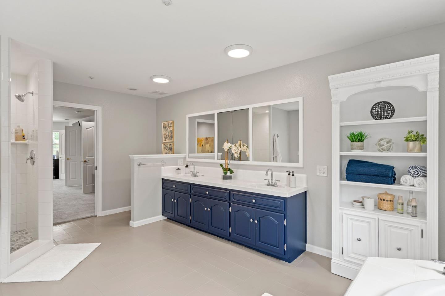 12135 Watsonville Road Gilroy, CA 95020 - Photo 35 of 83 a spacious bathroom with a granite countertop sink and a mirror
