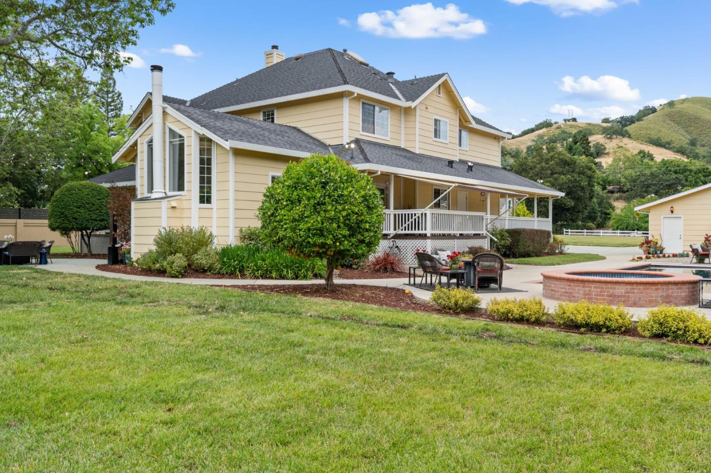 12135 Watsonville Road Gilroy, CA 95020 - Photo 49 of 83 a front view of a house with garden