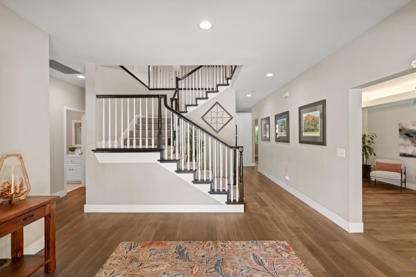 12135 Watsonville Road Gilroy, CA 95020 - Photo 5 of 83 a view of a hallway with wooden floor and staircase