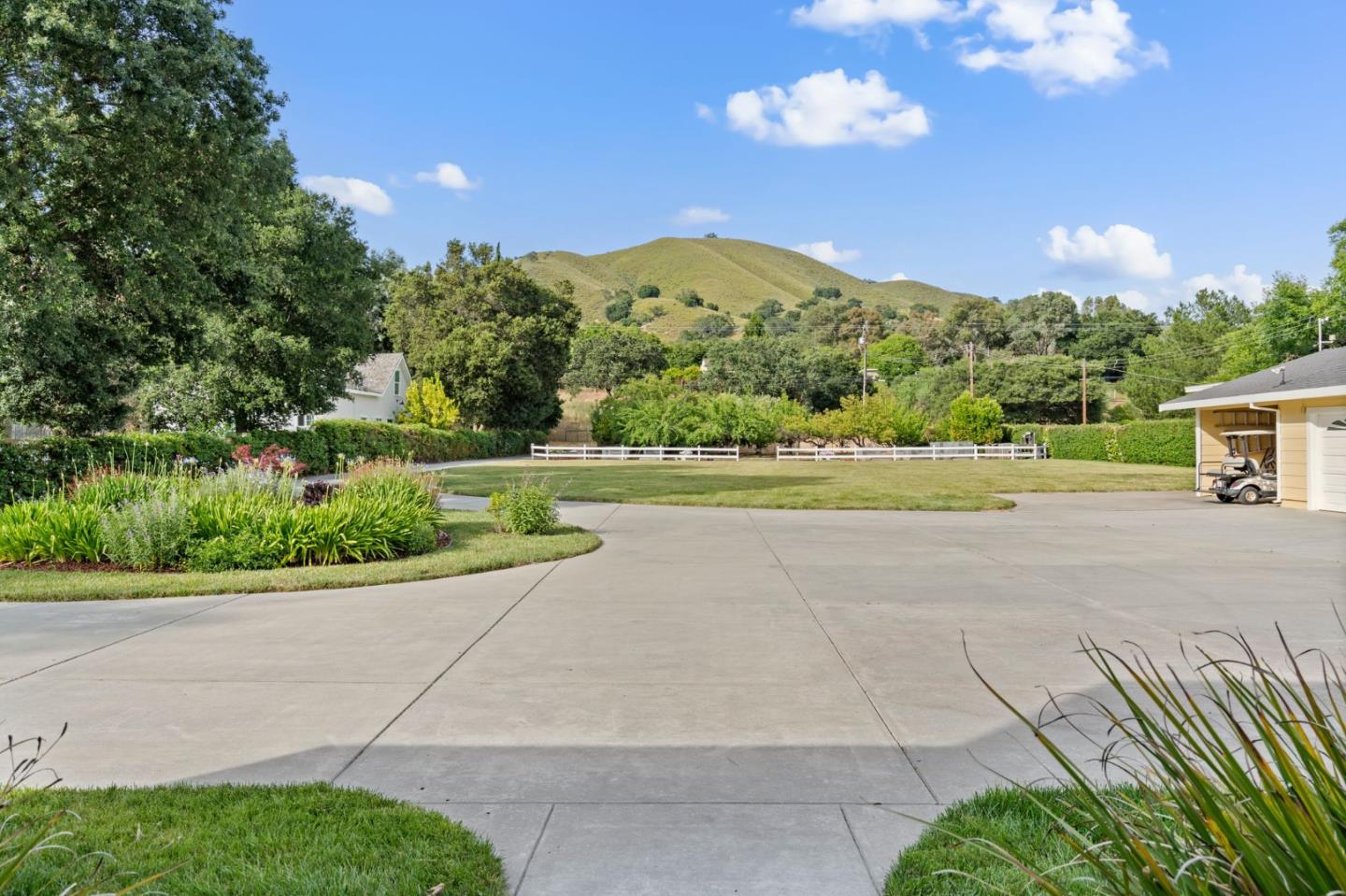 12135 Watsonville Road Gilroy, CA 95020 - Photo 61 of 83 a view of a house with a yard and a garden