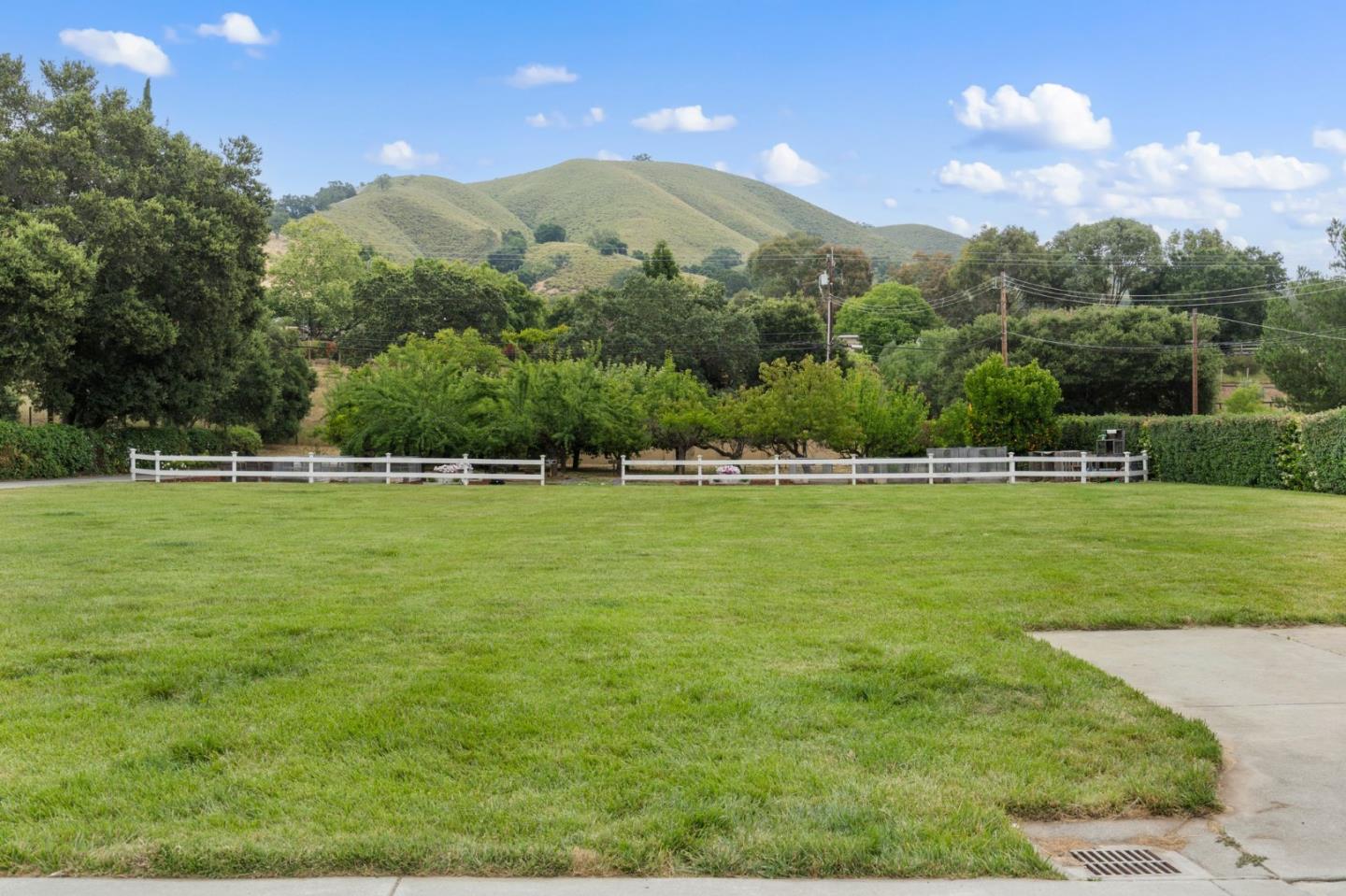 12135 Watsonville Road Gilroy, CA 95020 - Photo 66 of 83 a view of a green field with mountains in the background