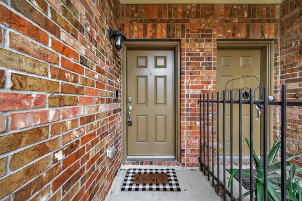 a view of a brick house with a door