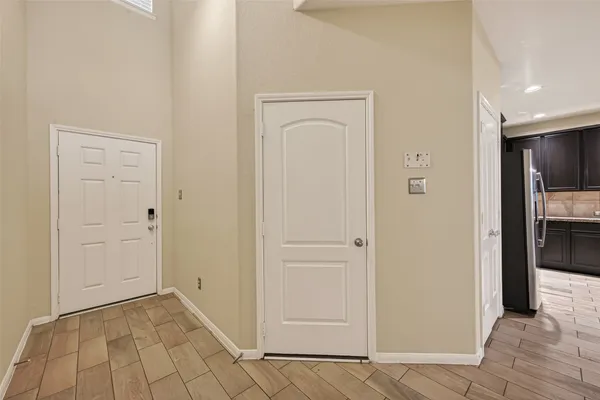 a view of a hallway with a dining area