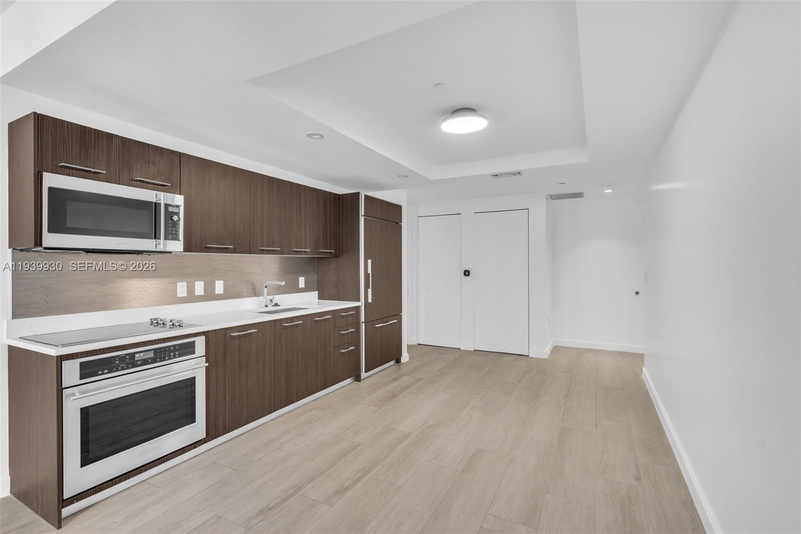 a kitchen with a stove and a microwave