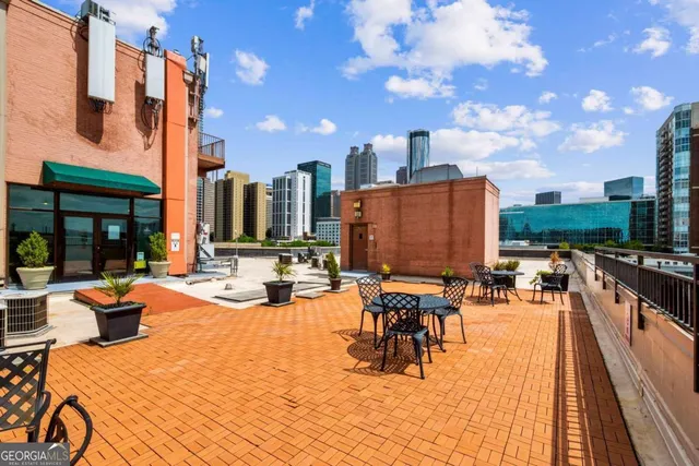 a view of a patio with swimming pool