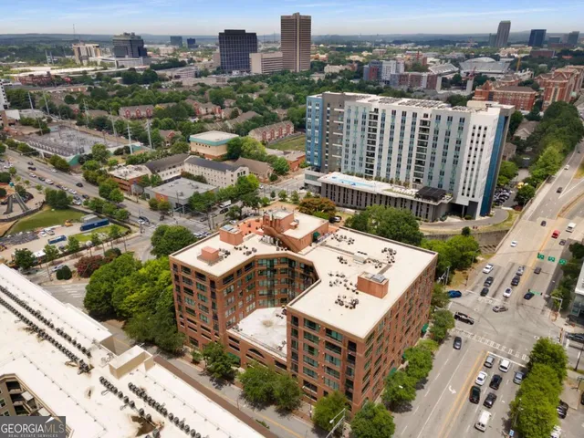 an aerial view of residential houses with outdoor space