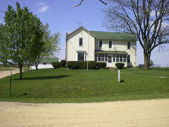 4228 West Racoon Road Oregon, IL 61061 - Photo 1 of 4 a front view of a house with a yard