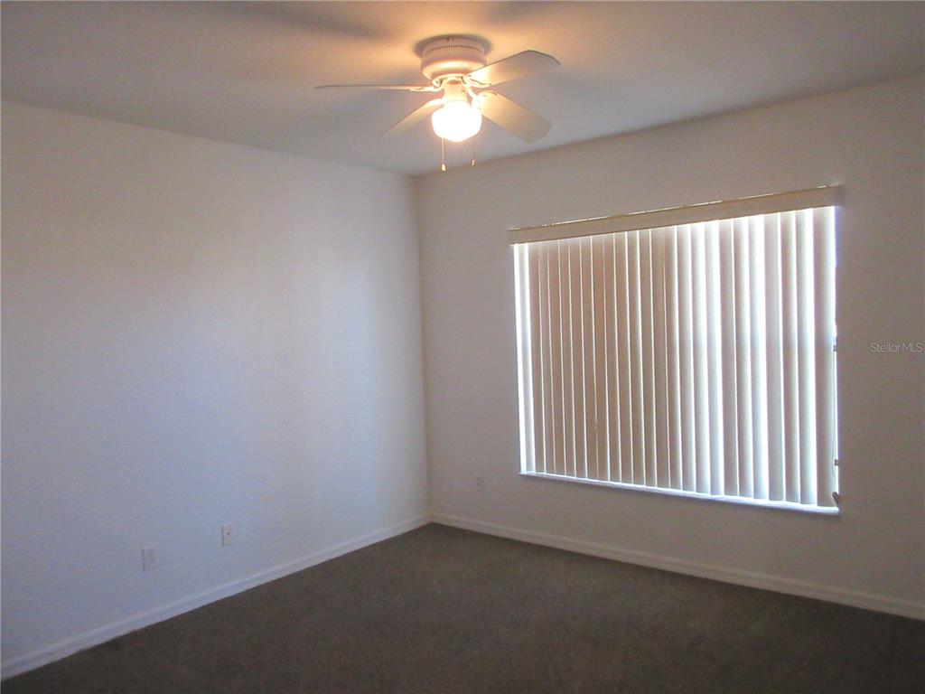 4760 Southwest 136th Place Ocala, FL 34473 - Photo 15 of 19 a view of a livingroom with a fan & a window