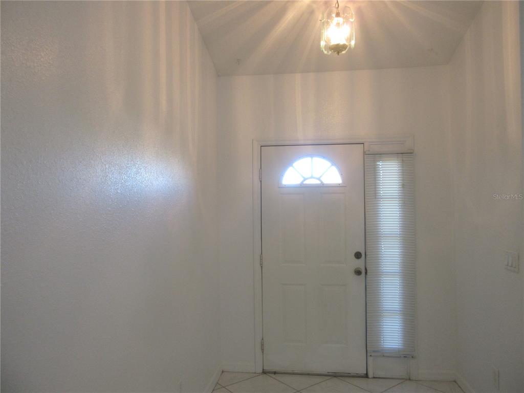 4760 Southwest 136th Place Ocala, FL 34473 - Photo 2 of 19 a bathroom with a light fixture and a window