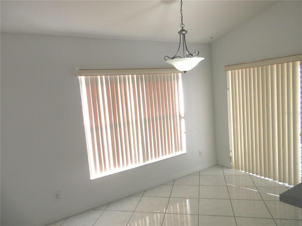 4760 Southwest 136th Place Ocala, FL 34473 - Photo 8 of 19 a view of an empty room with a window