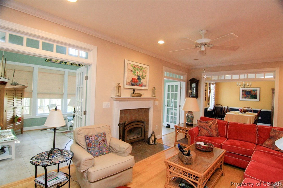 98 Flood Point Road Heathsville, VA 22473 - Photo 19 of 44 Gathering Room - Wood burning fireplace w/ access to sunroom, perfect gathering location for few or a crowd.