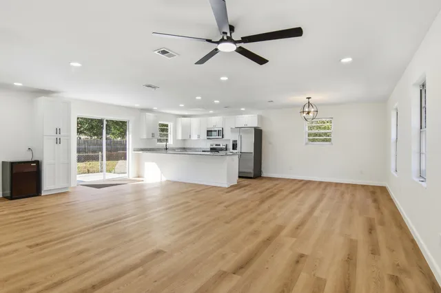 a view of kitchen with microwave and window