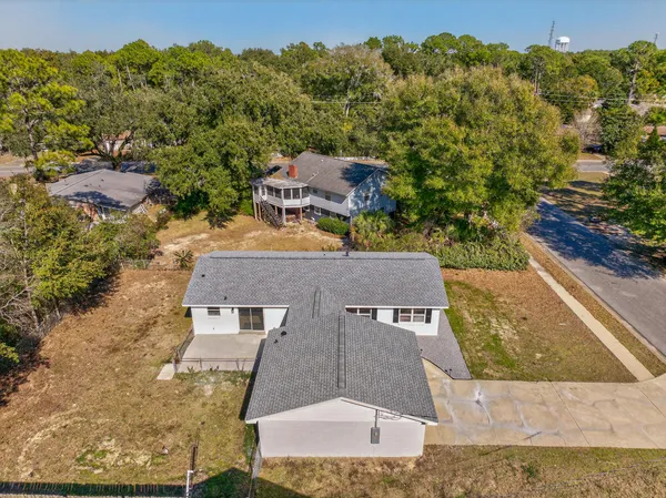 an aerial view of a house with swimming pool