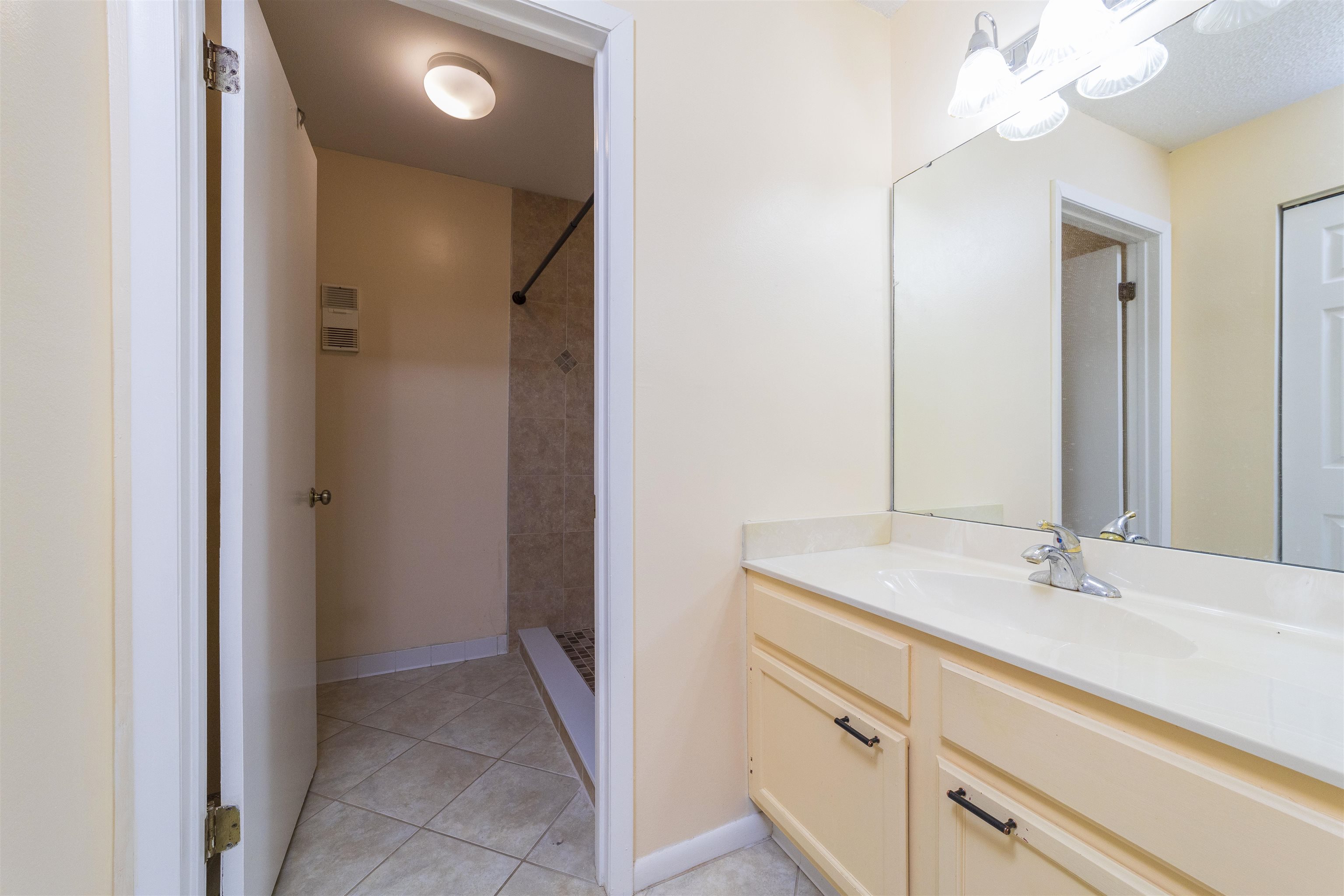 2 Catalonia Court St. Augustine, FL 32086 - Photo 11 of 28 a bathroom with a sink and a mirror