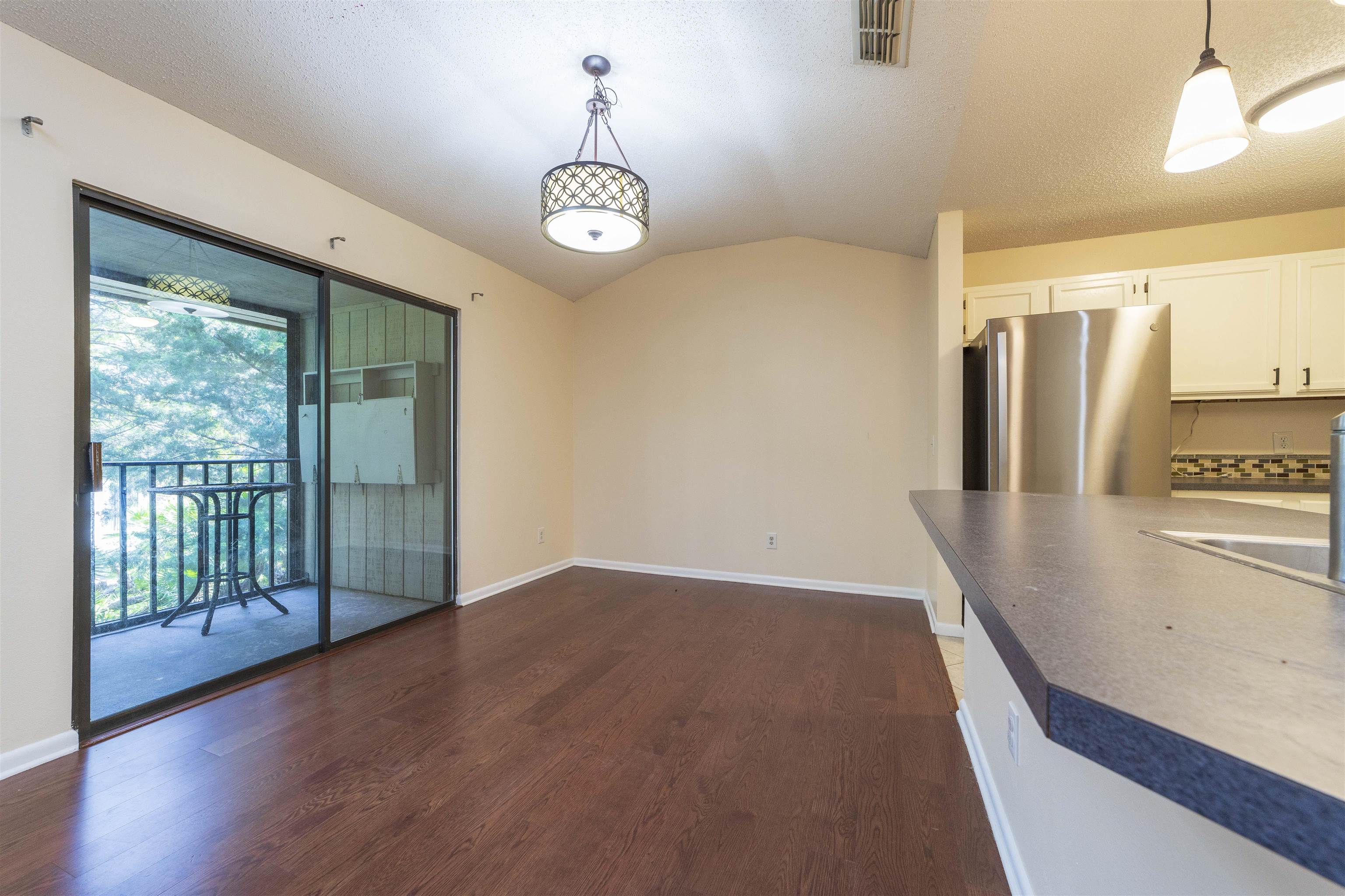 2 Catalonia Court St. Augustine, FL 32086 - Photo 19 of 28 a view of a room with wooden floor and an empty room