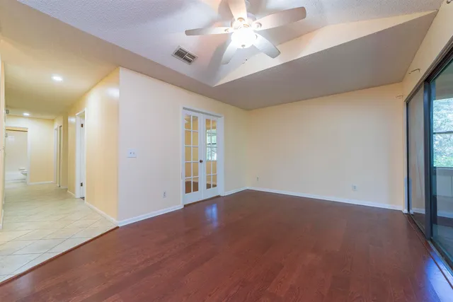 a view of an empty room with a window